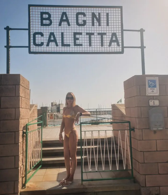 Entrance of Bagni Caletta, with a girl in a bikini
