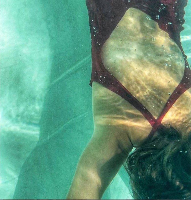 Dark red swimsuit underwater