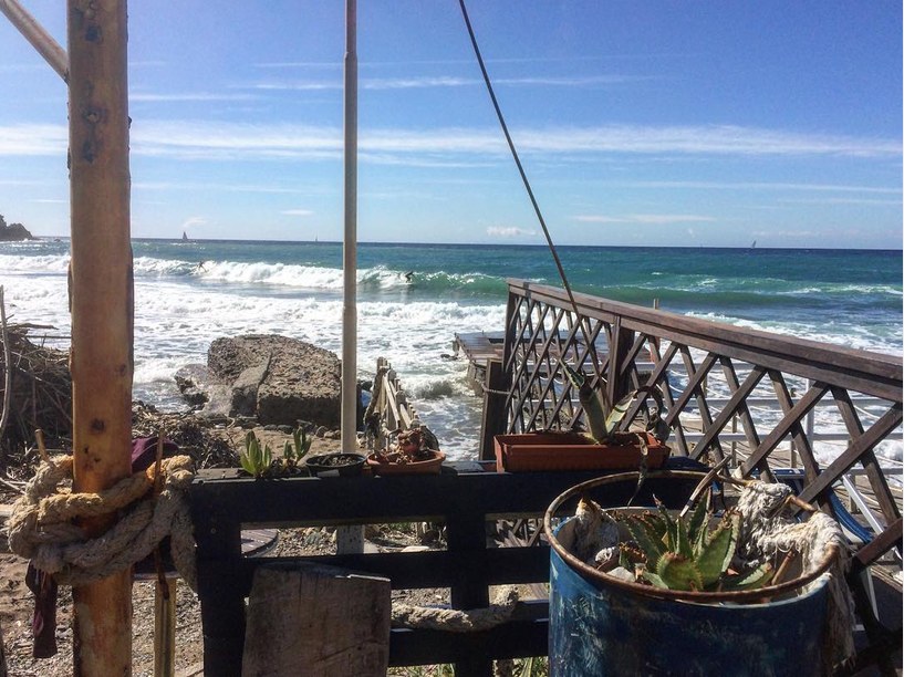 Wooden terrace over a rough sea