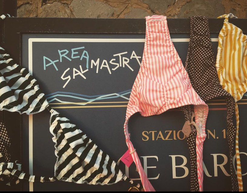 Salmastra bikinis hanging from the “Area Salmastra” sign